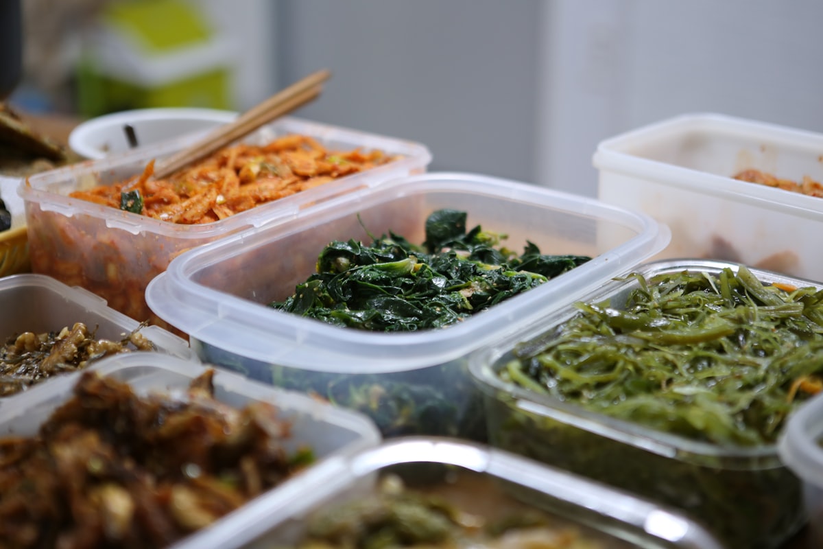Man preparing healthy meal with fresh vegetables and lean proteins